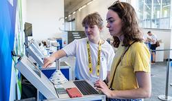 volunteer helping at kiosk