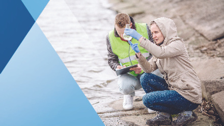 Scientists or biologists working together on water analysis